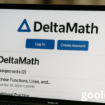 t Delta Math Login page displayed on a laptop screen with Log In and Create Account buttons, showing student assignments for online math learning.